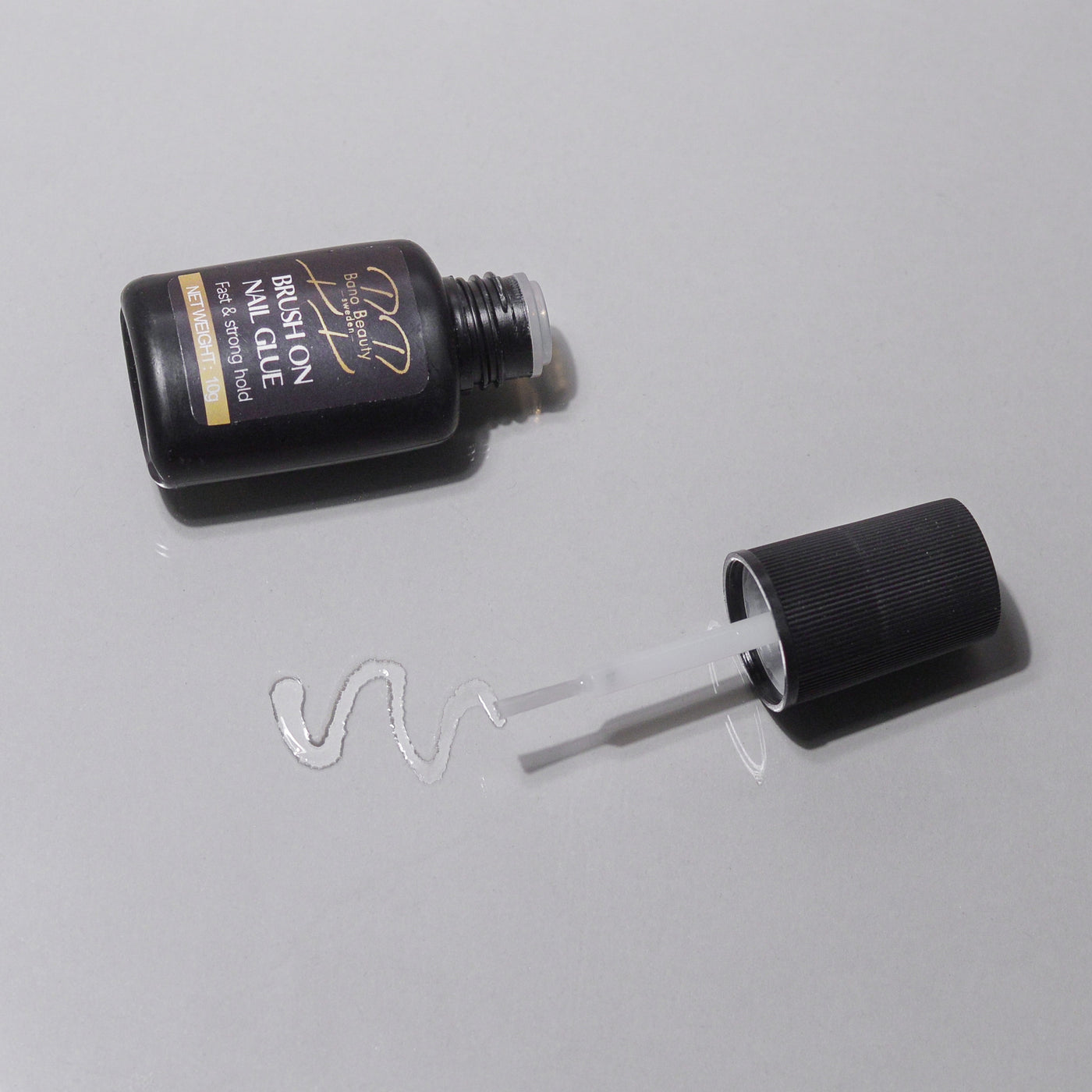 Brush on nail glue